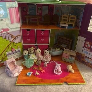 Calico Critters Lot - Animals, babies, furniture in a carry case house